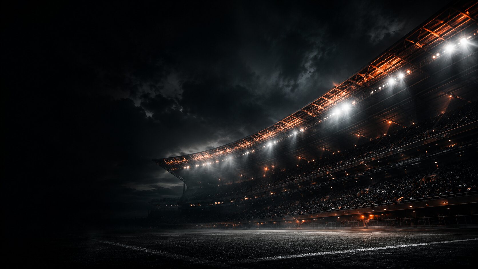 Floodlit stadium at night